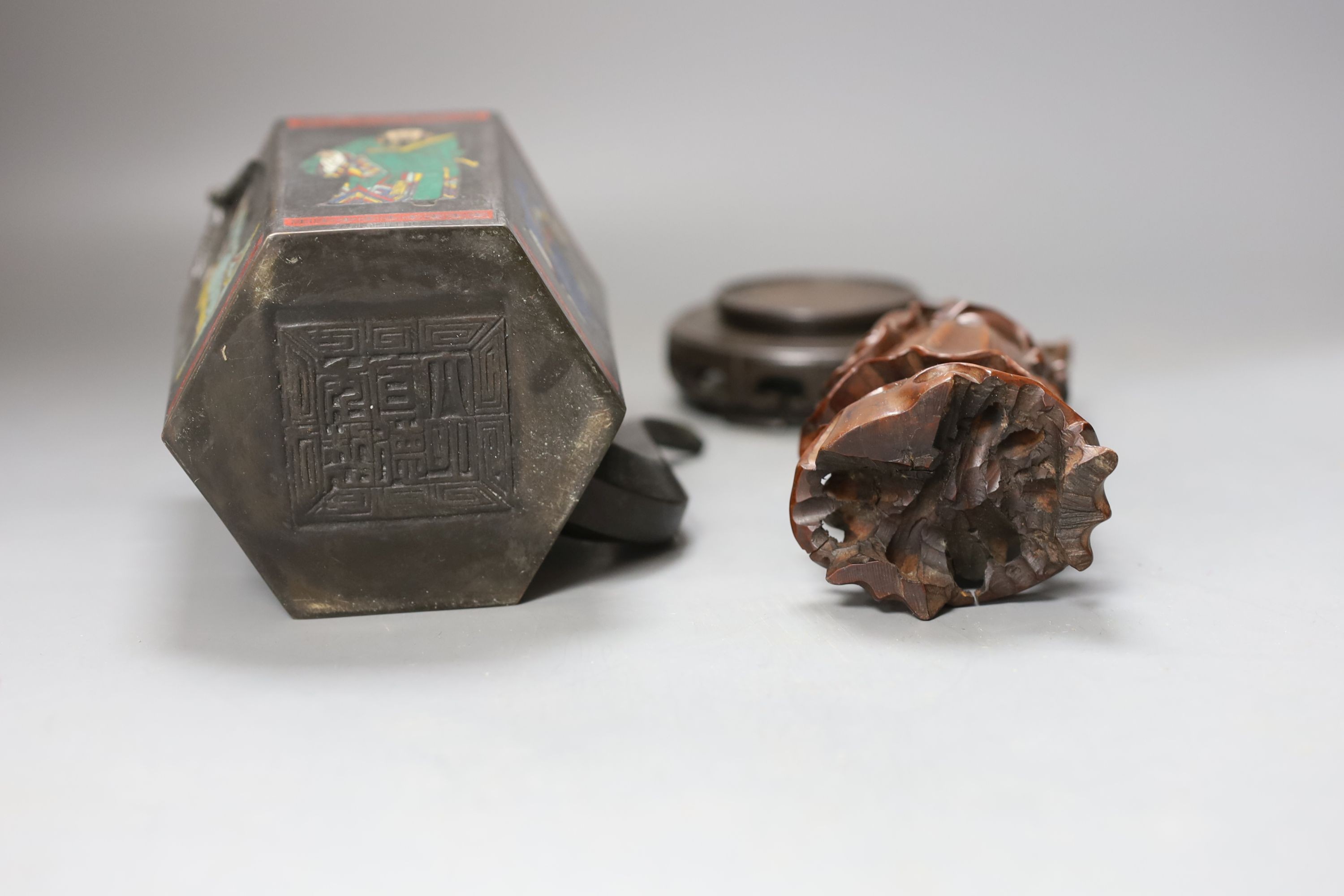 A Chinese carved hardwood figure of Shao Lao on hardwood stand and a similar painted metal teapot, figure 24cm including stand